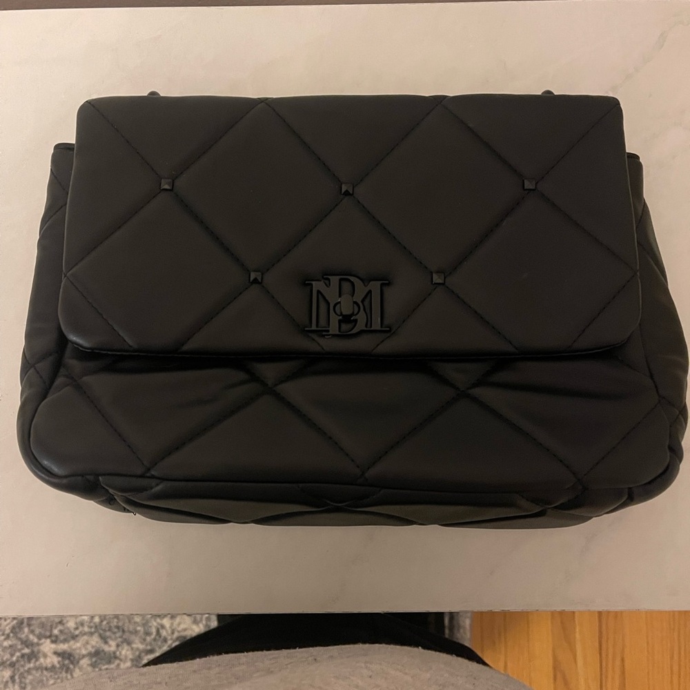 Chic Black Quilted Handbag with unique black chain